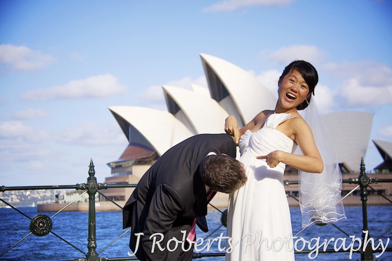 Groom kissing pregnant belly - wedding photography sydney